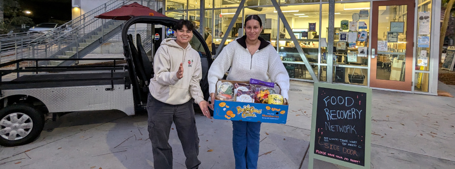 1 of 4, Two Food Recovery Network staff in front of Triton Food Pantry